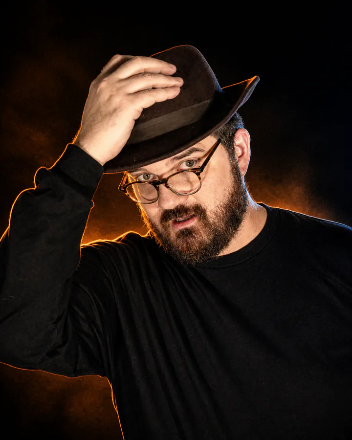 Glenn C. Hahn tipping his hat as The Wild Card